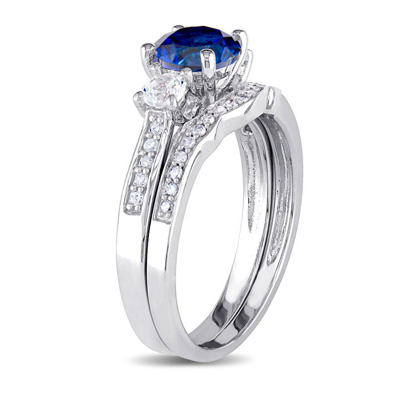 6.0mm Lab-Created Blue and White Sapphire with 1/8 CT. T.W. Diamond Three Stone Bridal Set in 10K White Gold